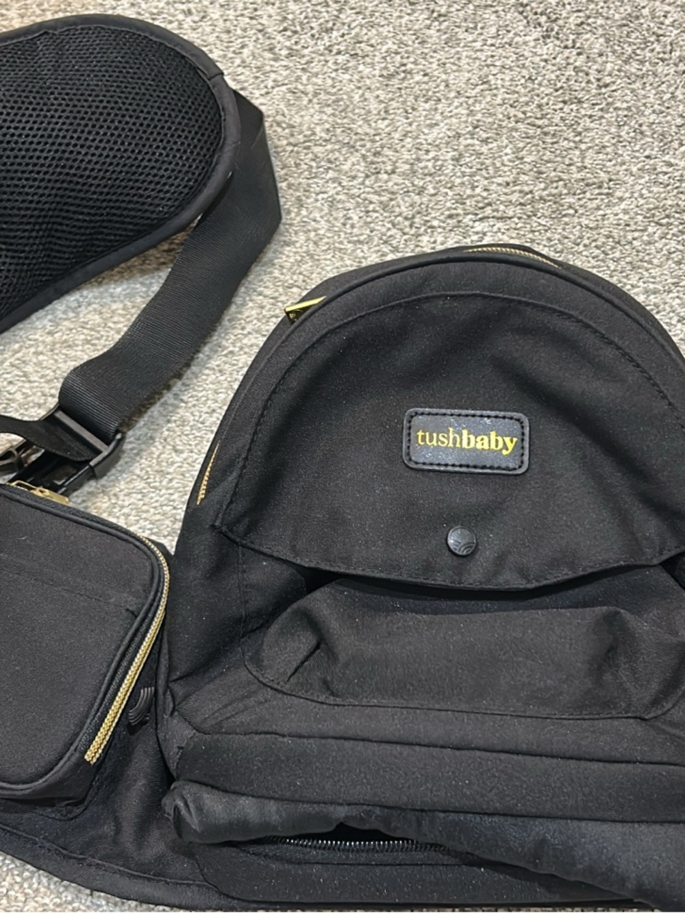 Tushbaby carrier with snug attachment